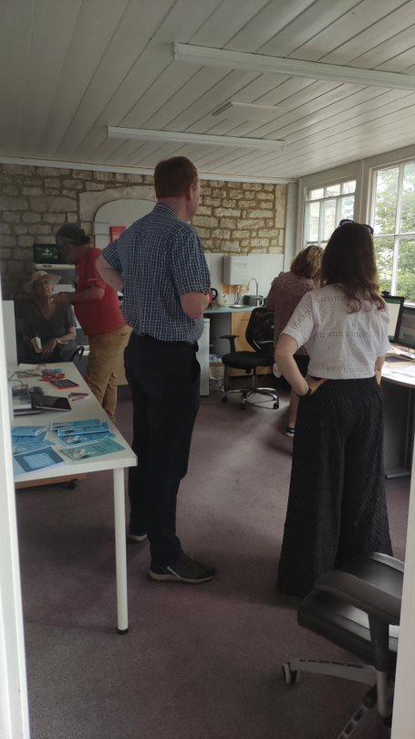Visitors being shown around an office 